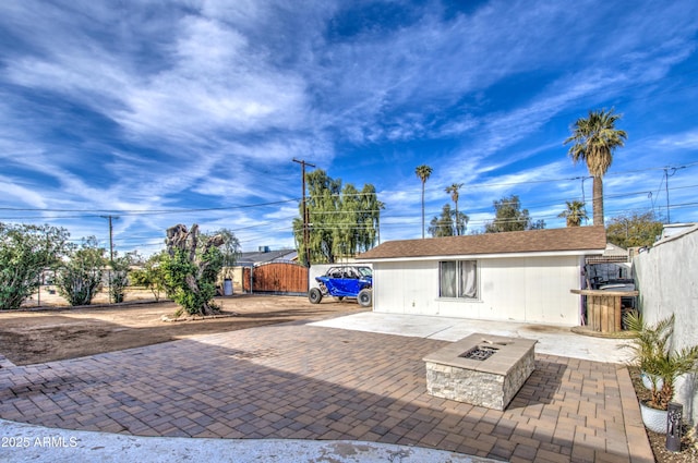 view of patio / terrace with an outdoor fire pit