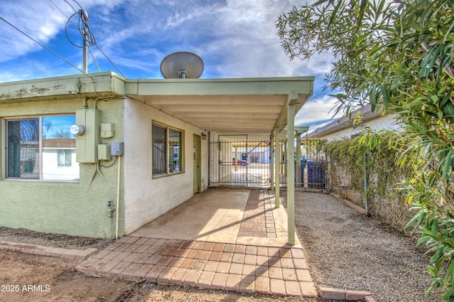 exterior space featuring a carport