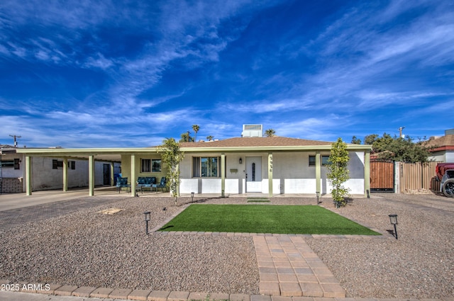 ranch-style home featuring a carport