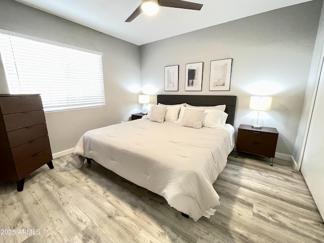 bedroom featuring light hardwood / wood-style floors and ceiling fan