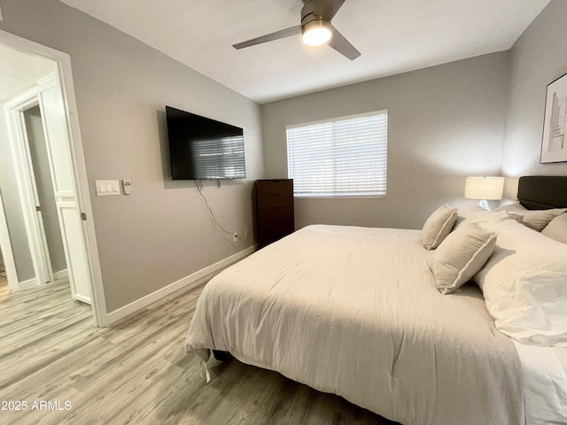 bedroom featuring hardwood / wood-style flooring and ceiling fan