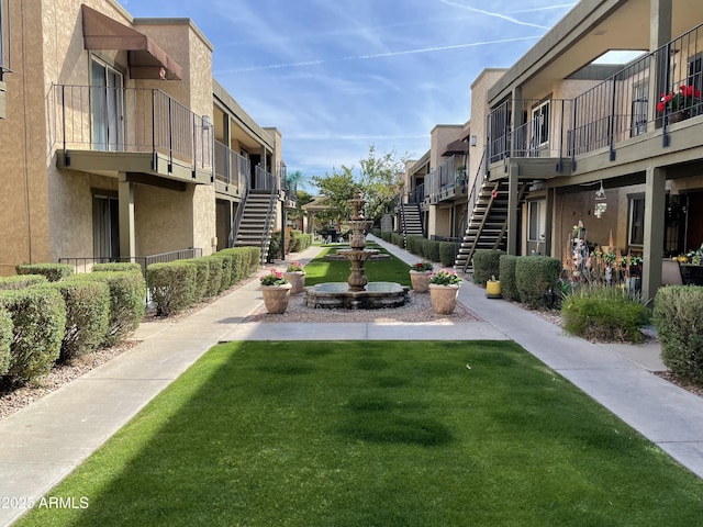 view of property's community featuring a lawn