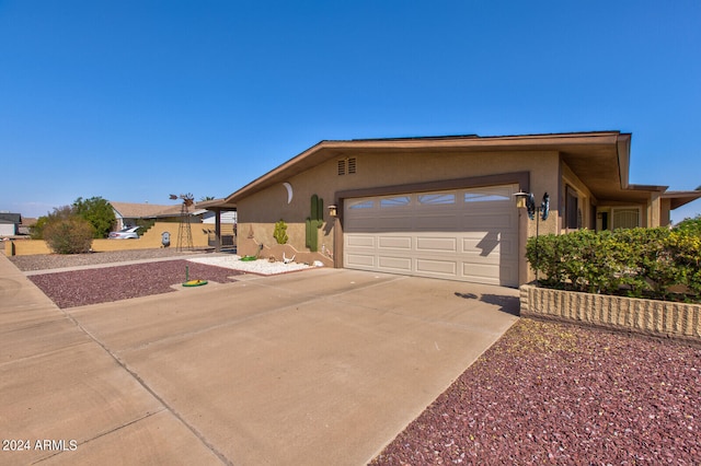 ranch-style house featuring a garage