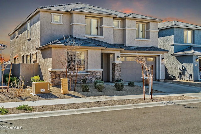 view of front of home with a garage