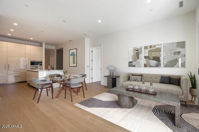 19355 N 73rd Way Unit A4004, Scottsdale, AZ 85255 - living room featuring recessed lighting, light wood-type flooring, and visible vents