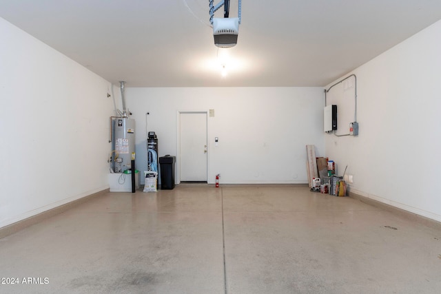 garage featuring a garage door opener and water heater