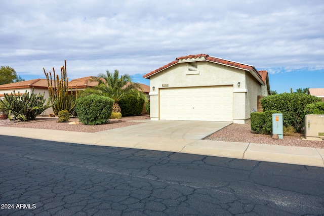 view of front of property with a garage