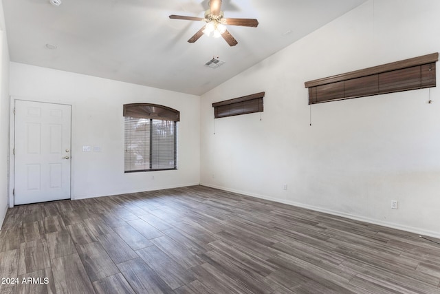 unfurnished room featuring hardwood / wood-style floors, lofted ceiling, and ceiling fan