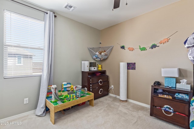 19561 W Woodlands Ave, Buckeye, AZ 85326 - recreation room featuring visible vents, baseboards, a ceiling fan, and carpet floors
