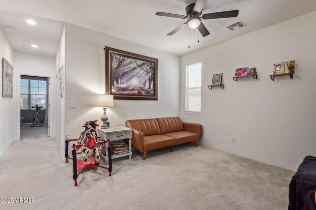 19561 W Woodlands Ave, Buckeye, AZ 85326 - sitting room featuring light colored carpet, ceiling fan, and visible vents