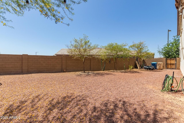 19561 W Woodlands Ave, Buckeye, AZ 85326 - view of yard featuring a fenced backyard