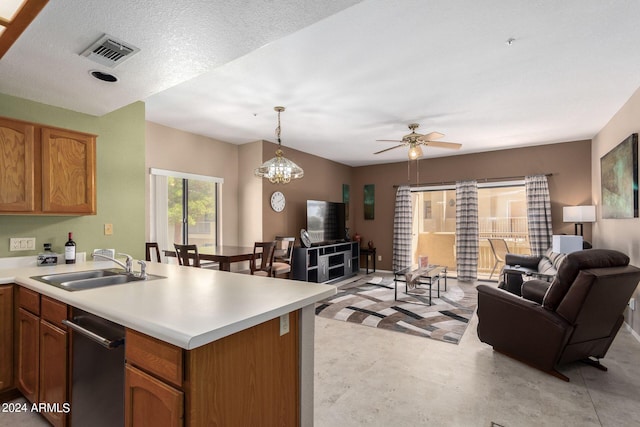 kitchen with sink, stainless steel dishwasher, decorative light fixtures, light carpet, and ceiling fan with notable chandelier