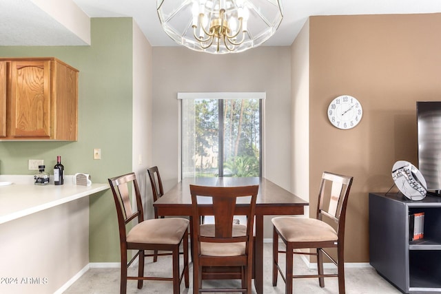 dining area with a chandelier and light colored carpet