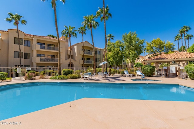 view of swimming pool with a patio area