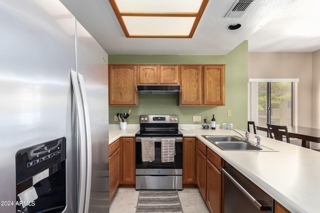 kitchen featuring stainless steel appliances and sink