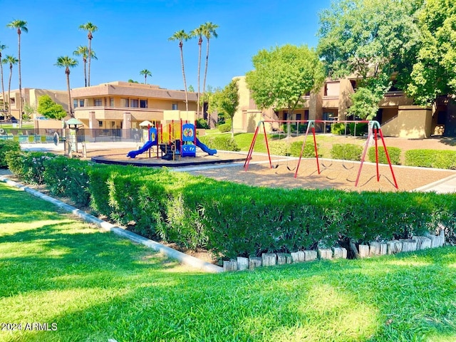 view of jungle gym with a lawn