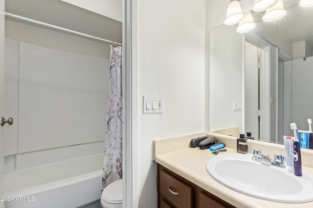 full bathroom featuring vanity, shower / bath combo, and toilet