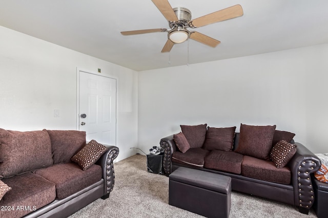 carpeted living room featuring ceiling fan