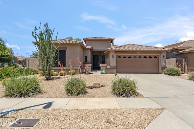 35402 N 32nd Dr, Phoenix, AZ 85086 - mediterranean / spanish-style home with stucco siding, an attached garage, concrete driveway, and a tiled roof