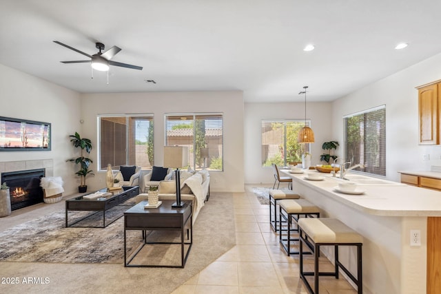 35402 N 32nd Dr, Phoenix, AZ 85086 - living area featuring a fireplace, recessed lighting, light tile patterned floors, and ceiling fan