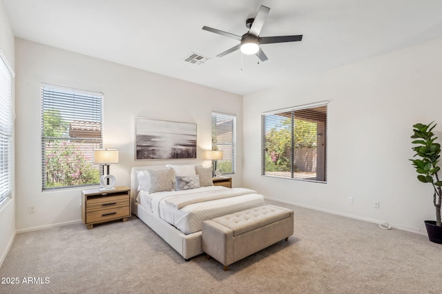 35402 N 32nd Dr, Phoenix, AZ 85086 - bedroom with light carpet, multiple windows, and a ceiling fan