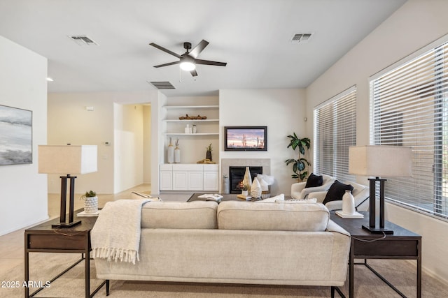 35402 N 32nd Dr, Phoenix, AZ 85086 - living area with a fireplace, a ceiling fan, and built in shelves