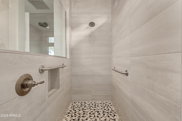 bathroom with tiled shower