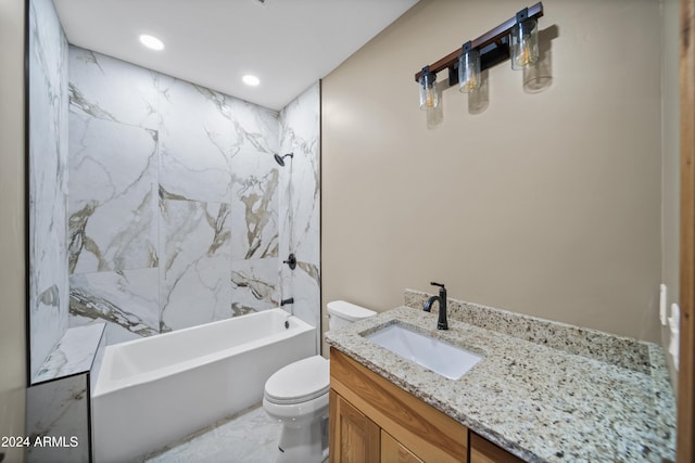 full bathroom with vanity, toilet, and tiled shower / bath