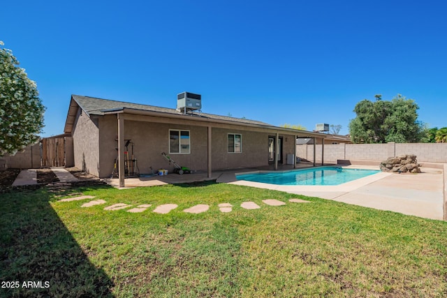 1302 E Forge Ave, Mesa, AZ 85204 - back of property featuring a fenced backyard, a patio area, a fenced in pool, and stucco siding