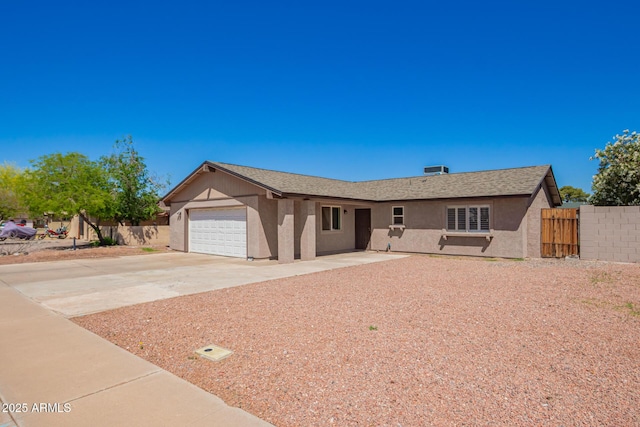 1302 E Forge Ave, Mesa, AZ 85204 - single story home with an attached garage, concrete driveway, fence, and stucco siding