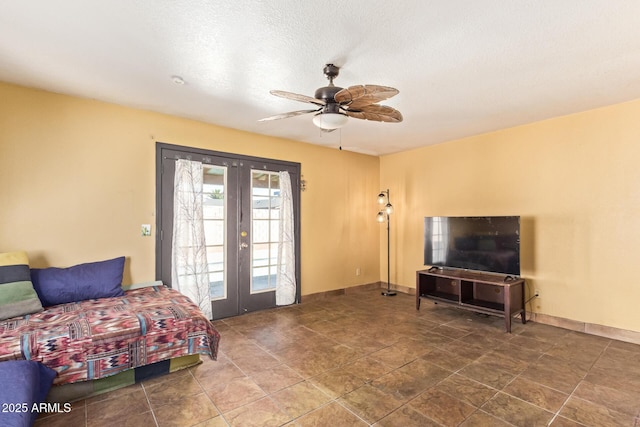 1302 E Forge Ave, Mesa, AZ 85204 - living room featuring french doors, baseboards, and ceiling fan