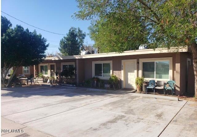 ranch-style home with a patio area