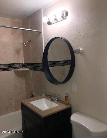 bathroom with toilet and vanity