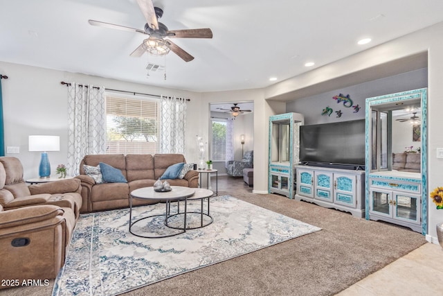 living room with visible vents, a ceiling fan, and recessed lighting