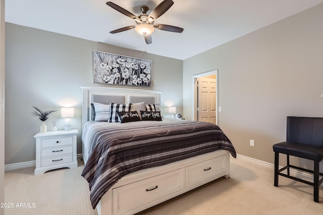 bedroom featuring baseboards, light carpet, and ceiling fan