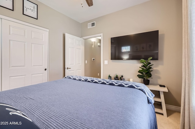 bedroom with visible vents, carpet flooring, a ceiling fan, and baseboards