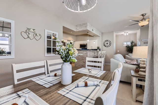 dining space with a ceiling fan