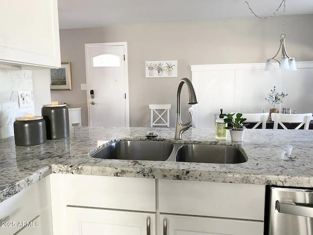 2100 N Normal Ave, Tempe, AZ 85288 - kitchen featuring dishwasher, white cabinetry, backsplash, and light stone countertops