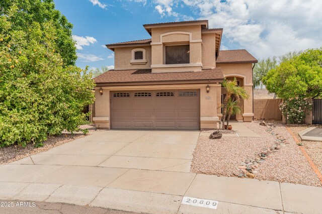 20809 N 1st Ave, Phoenix, AZ 85027 - view of front of house with stucco siding, an attached garage, concrete driveway, and fence