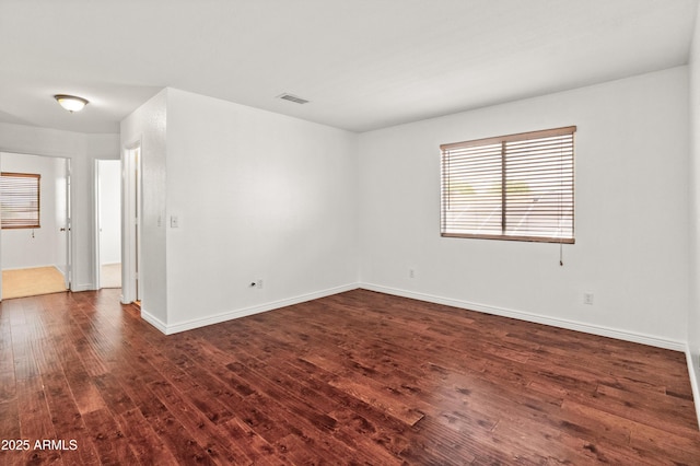 20809 N 1st Ave, Phoenix, AZ 85027 - unfurnished room with dark wood-style floors and baseboards