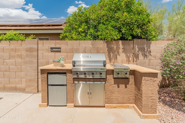 20809 N 1st Ave, Phoenix, AZ 85027 - view of patio / terrace with an outdoor kitchen, a grill, and fence
