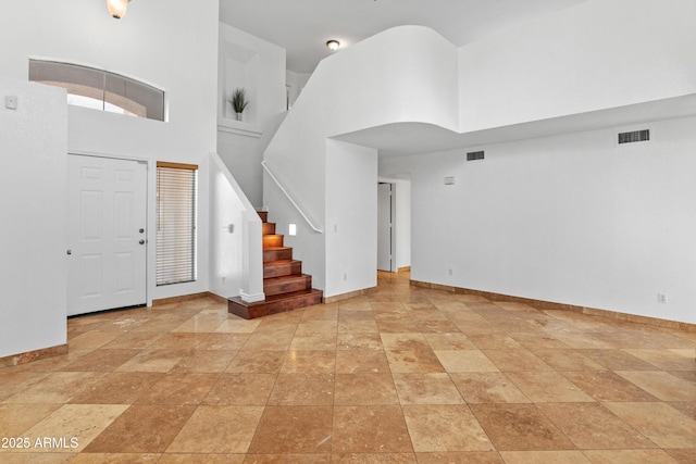 20809 N 1st Ave, Phoenix, AZ 85027 - entryway with a high ceiling, stairway, and baseboards