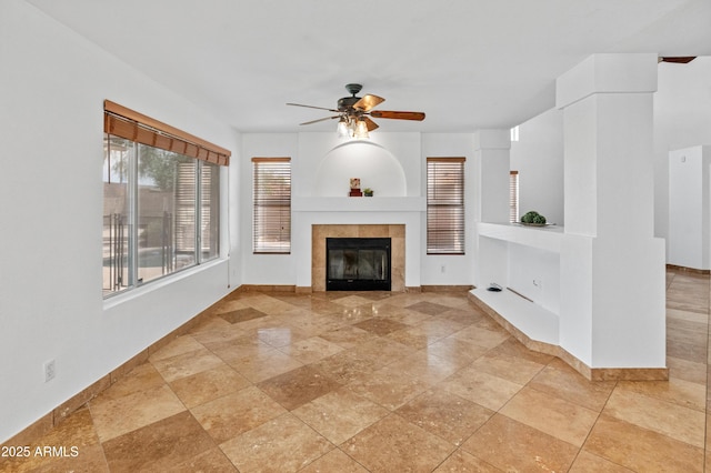 20809 N 1st Ave, Phoenix, AZ 85027 - unfurnished living room with a ceiling fan, baseboards, and a tile fireplace