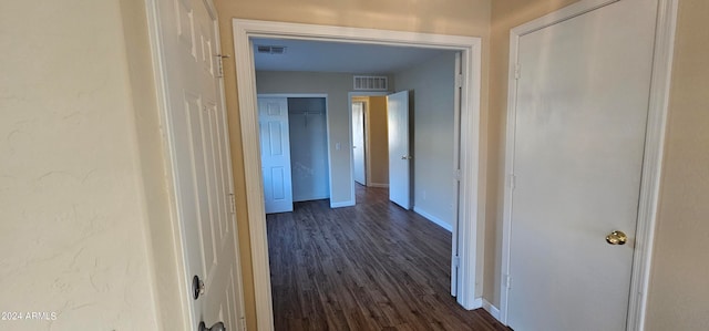 hall with dark hardwood / wood-style flooring