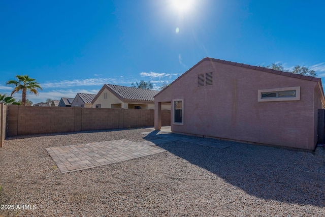 view of yard featuring a fenced backyard and a patio