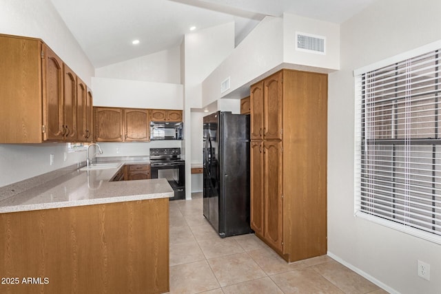 kitchen with black appliances, kitchen peninsula, light tile patterned floors, high vaulted ceiling, and sink