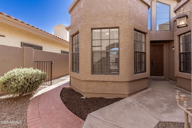 entrance to property featuring a patio area