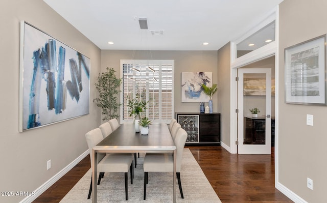 dining room with recessed lighting, visible vents, baseboards, and wood finished floors