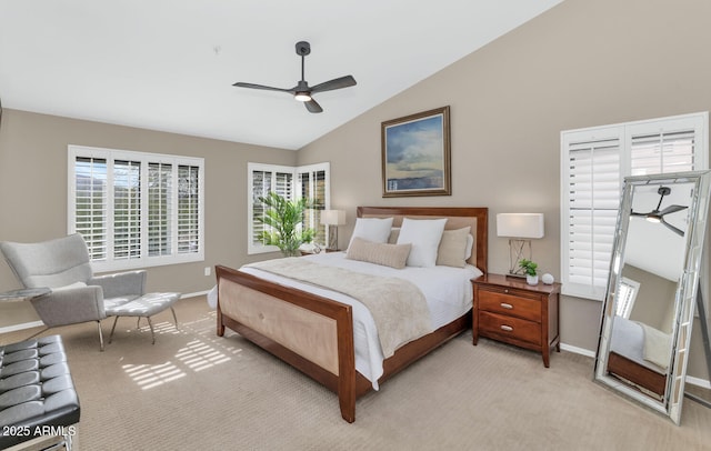 bedroom featuring light carpet, lofted ceiling, a ceiling fan, and baseboards