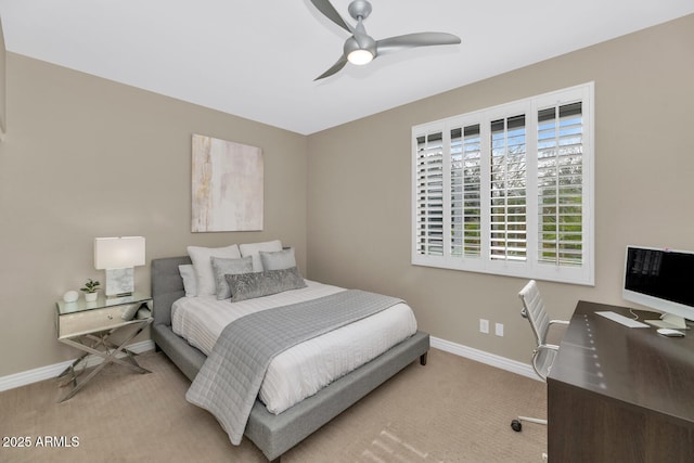 carpeted bedroom featuring a ceiling fan and baseboards